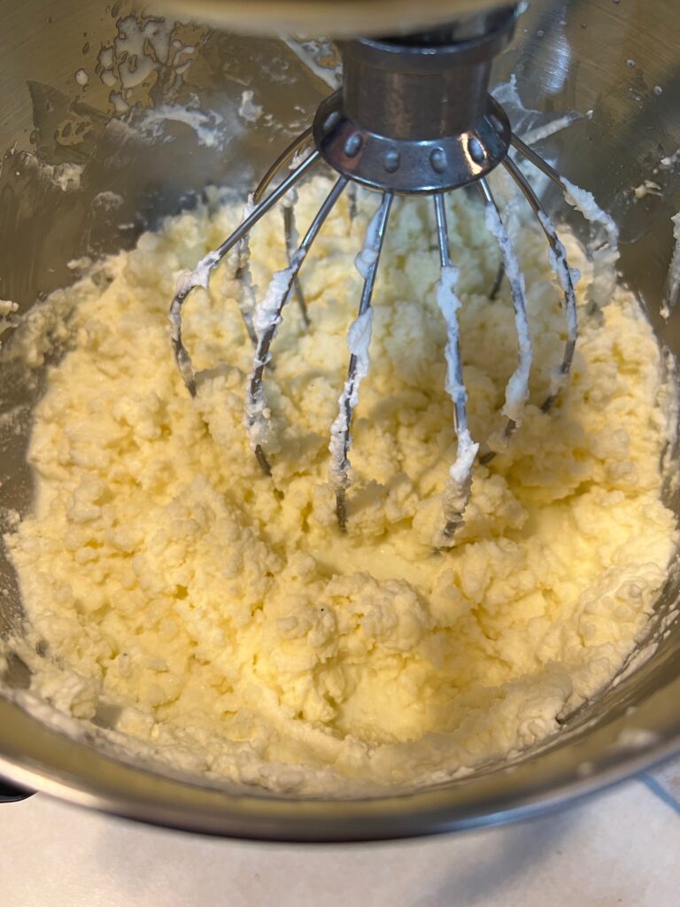 Whipped cream starting to sepeate in a stand mixer