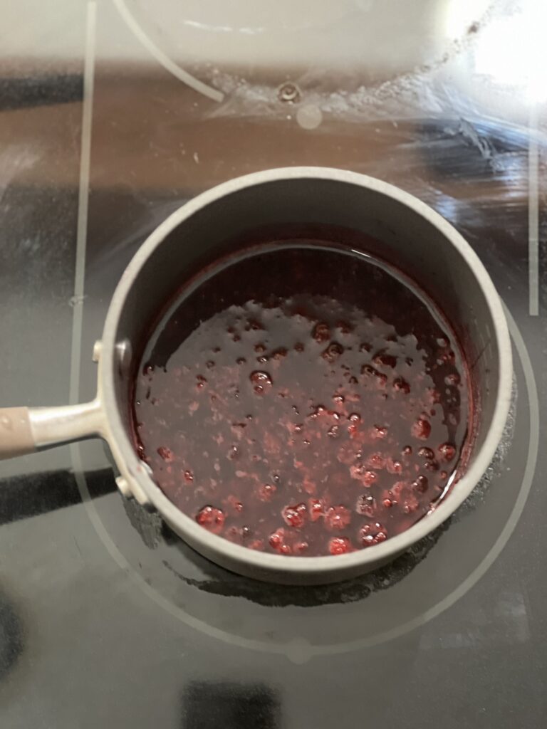 Wild blackberry jam cooking on the stove top