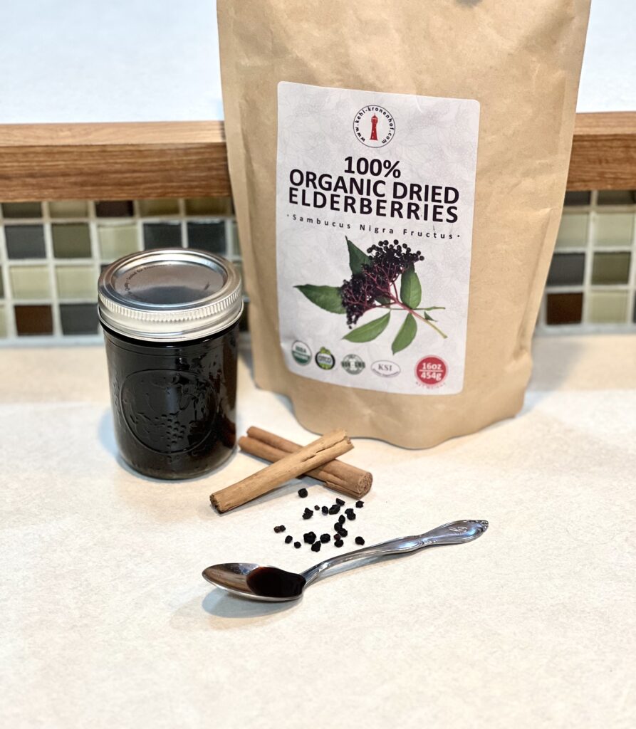 Canned elderberry syrup on the kitchen counter